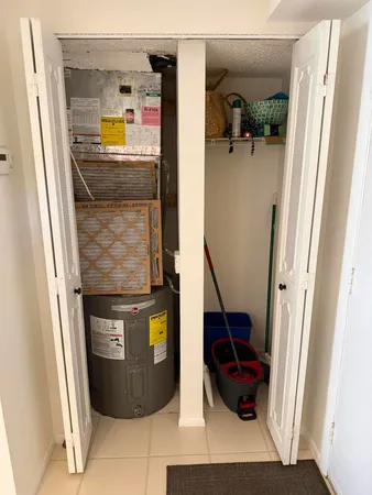 a kitchen with kitchen island granite countertop a sink stainless steel appliances and cabinets
