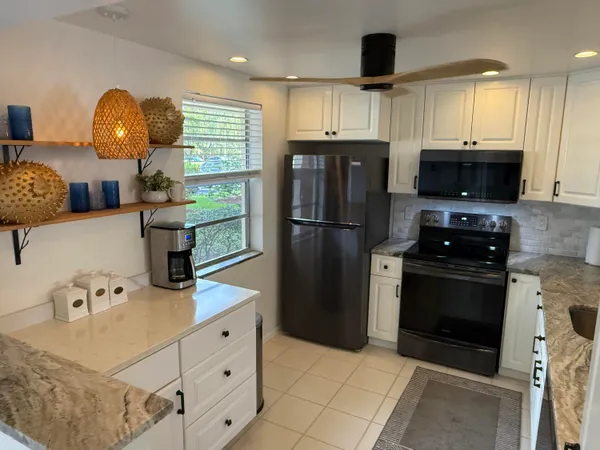 a kitchen with a sink and a window