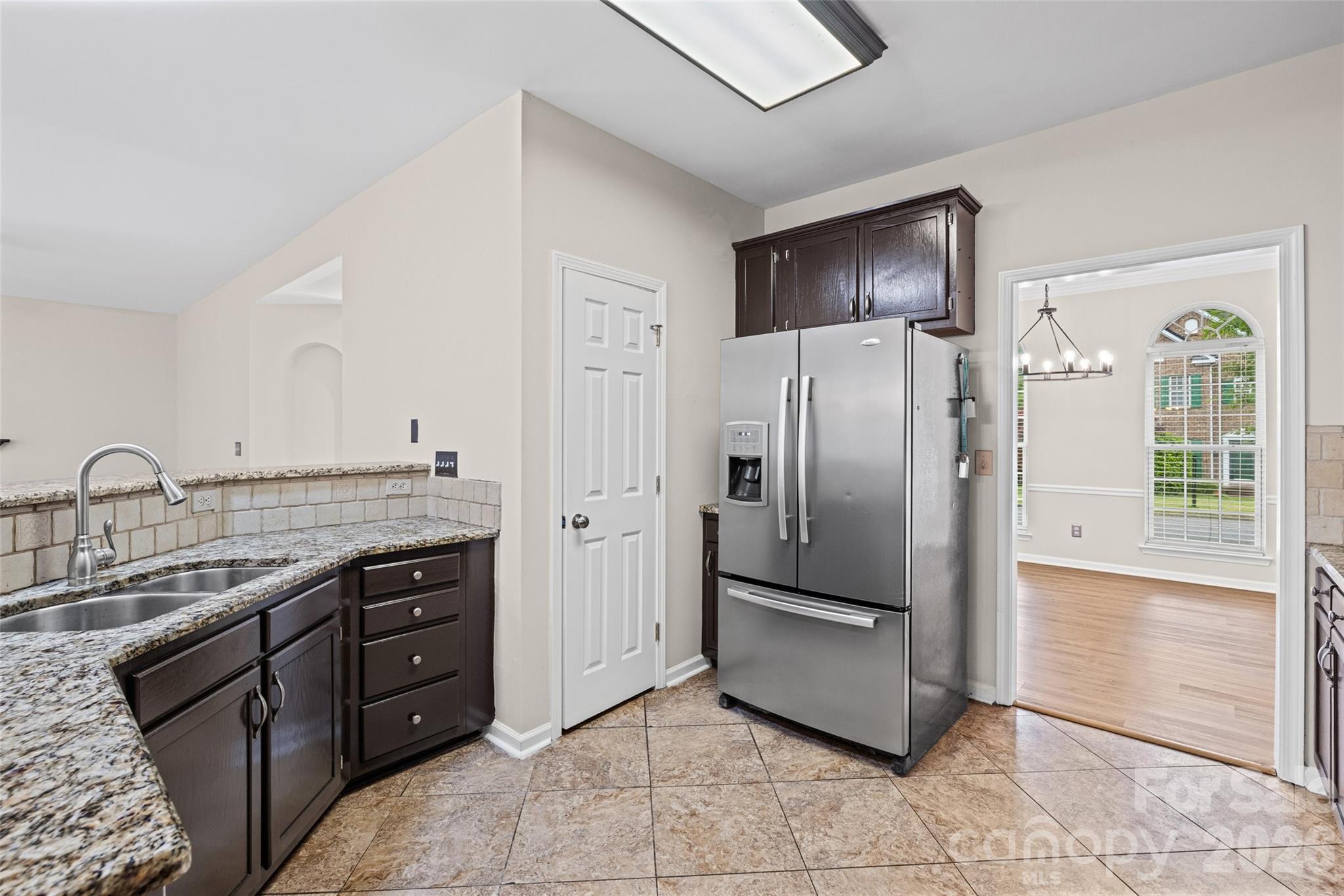 620 East Cheval Drive Fort Mill, SC 29708 - Photo 15 of 48 a kitchen with stainless steel appliances granite countertop a refrigerator and a sink