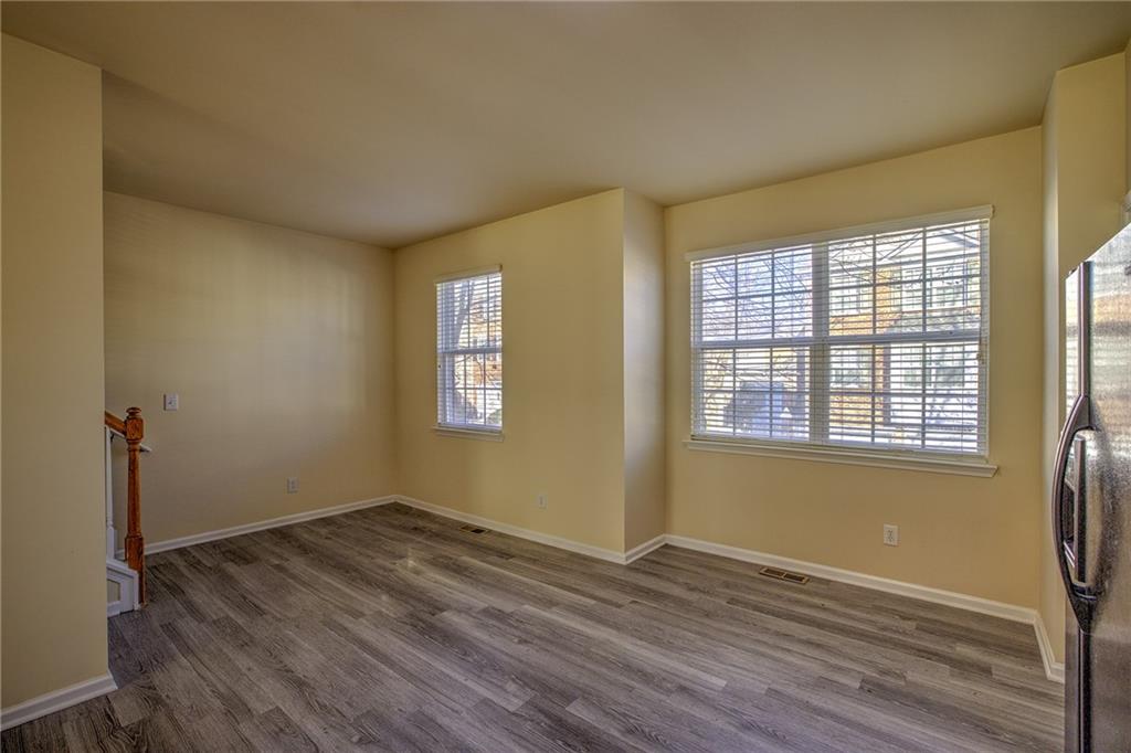 2247 Landing Ridge Drive Duluth, GA 30097 - Photo 13 of 24 an empty room with wooden floor and windows