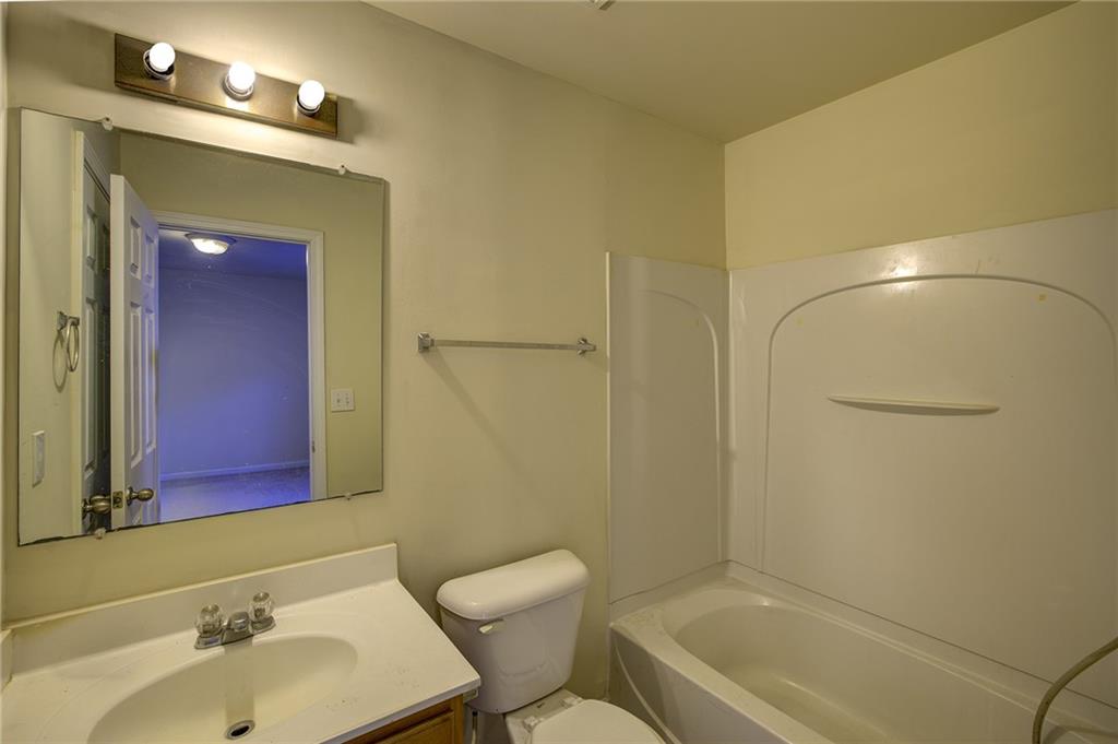 2247 Landing Ridge Drive Duluth, GA 30097 - Photo 7 of 24 a bathroom with a sink and a mirror