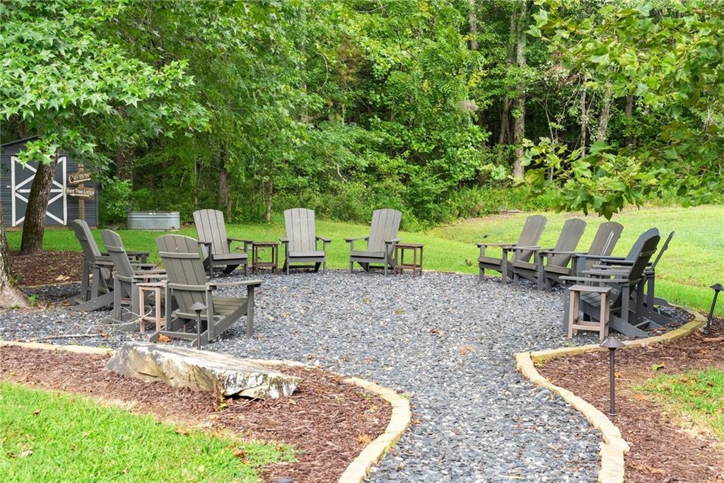 253 Happy Trails Way Jasper, GA 30143 - Photo 5 of 97 a view of a backyard with sitting area