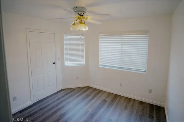 a view of an entryway with wooden floor