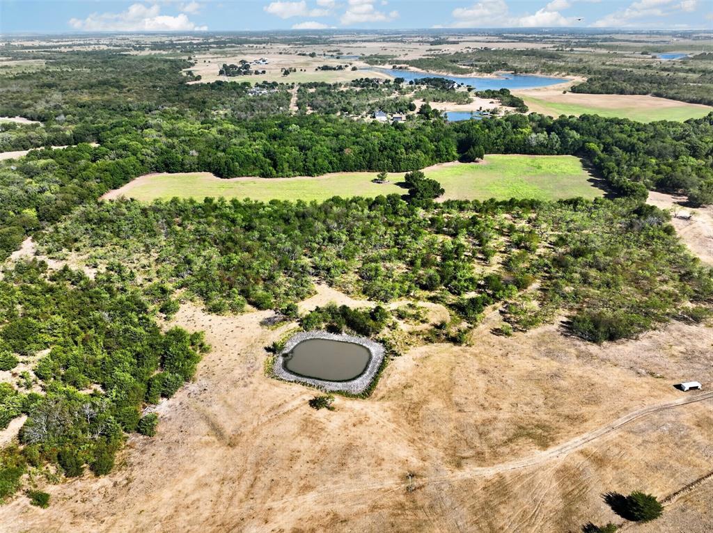 0 Novy Road Ennis, TX 75119 - Photo 4 of 25 Expansive acreage featuring a private pond, open pastures, and wooded areas