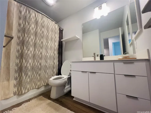 a bathroom with a toilet and a sink