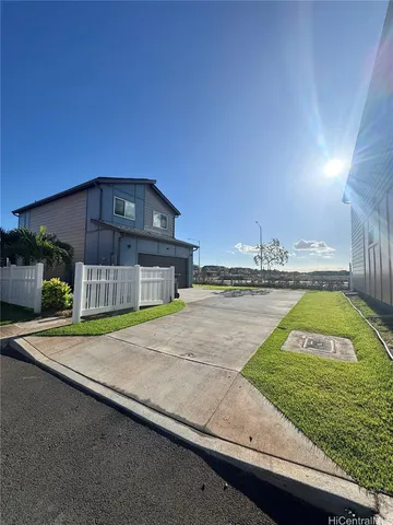 a view of a swimming pool with a yard