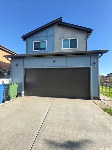 a front view of a house with garage