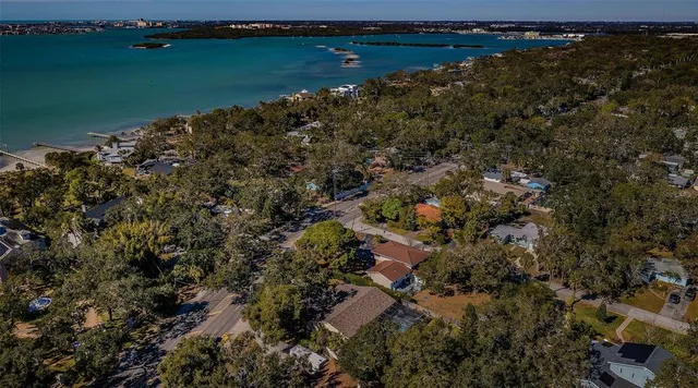 an aerial view of a houses with a lake view