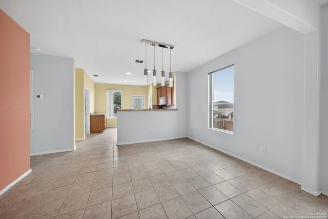 a view of a kitchen with a sink and a window