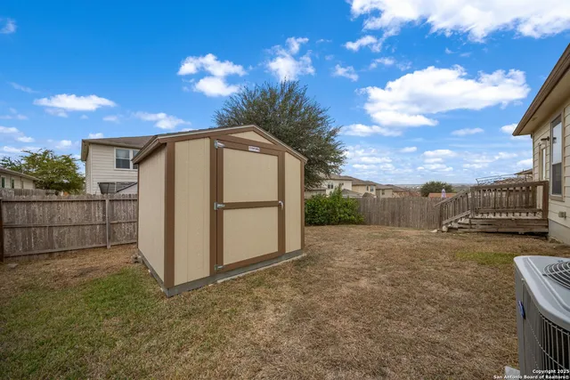 a view of a backyard of the house