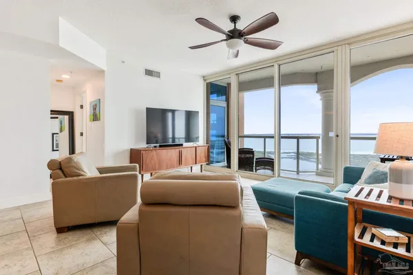 a living room with furniture and a large window