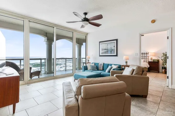 a living room with furniture and a large window