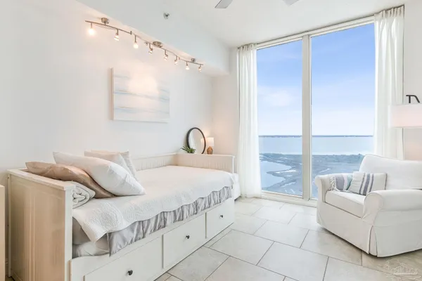 a bedroom with a bed and a couch
