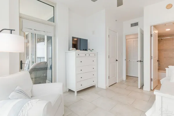 a bedroom with a bed and a television