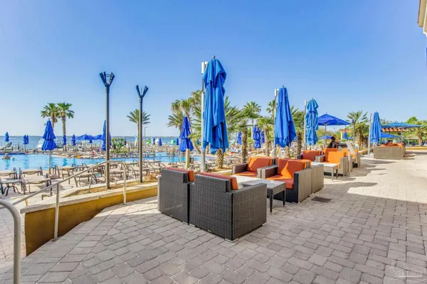 a view of a chairs and tables in the patio
