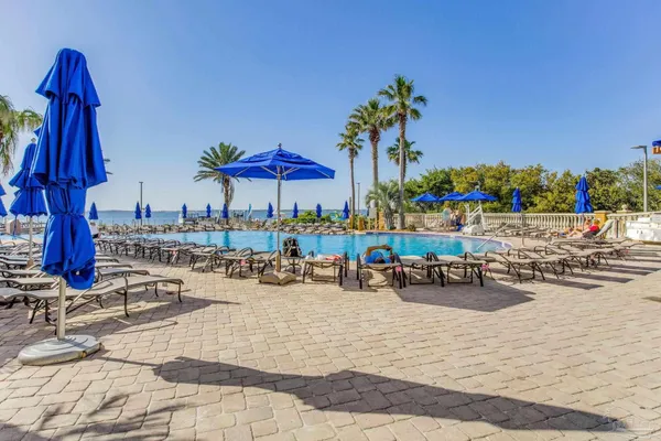 a view of swimming pool with outdoor seating