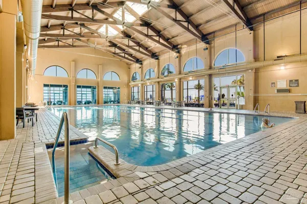 a view of swimming pool from a balcony