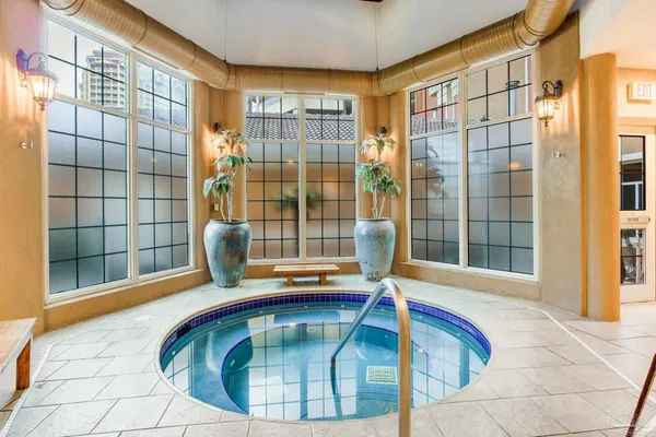 a bedroom with a bed and a shower