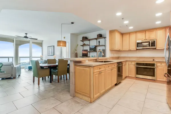 a kitchen with a sink cabinets and window