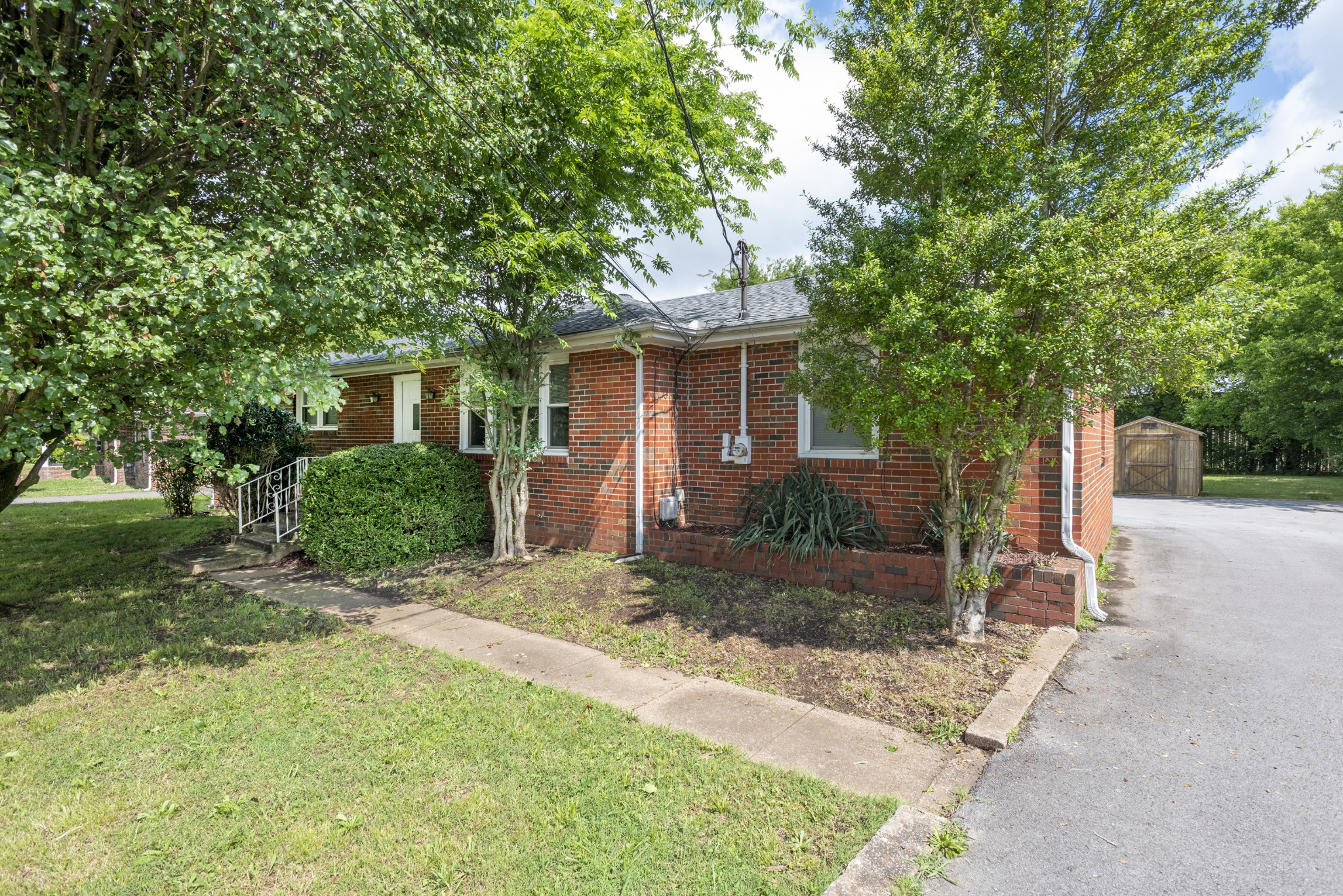 598 Franklin Road Lebanon, TN 37087 - Photo 1 of 18 a front view of a house with a yard and trees