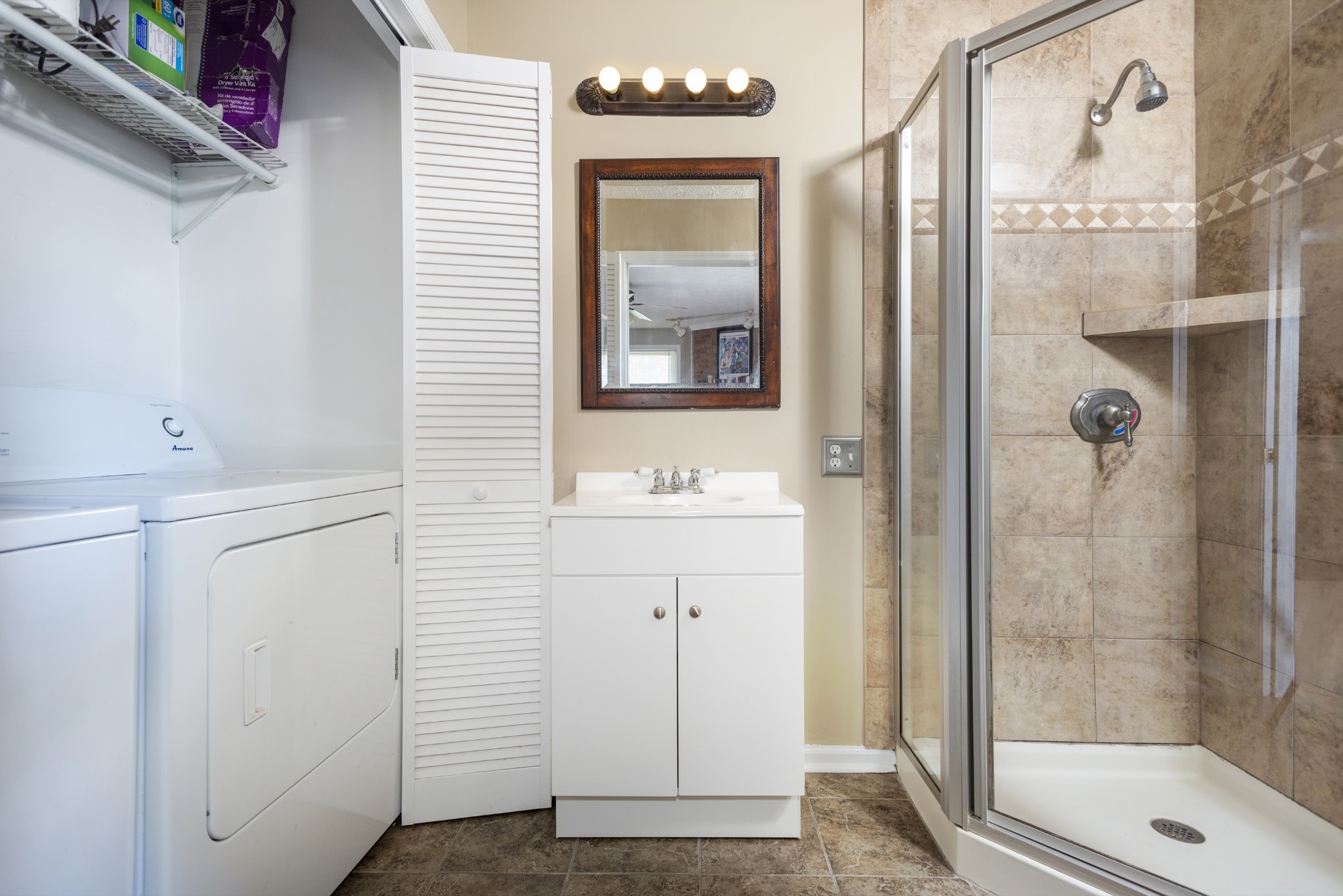 598 Franklin Road Lebanon, TN 37087 - Photo 9 of 18 a bathroom with a shower sink and mirror