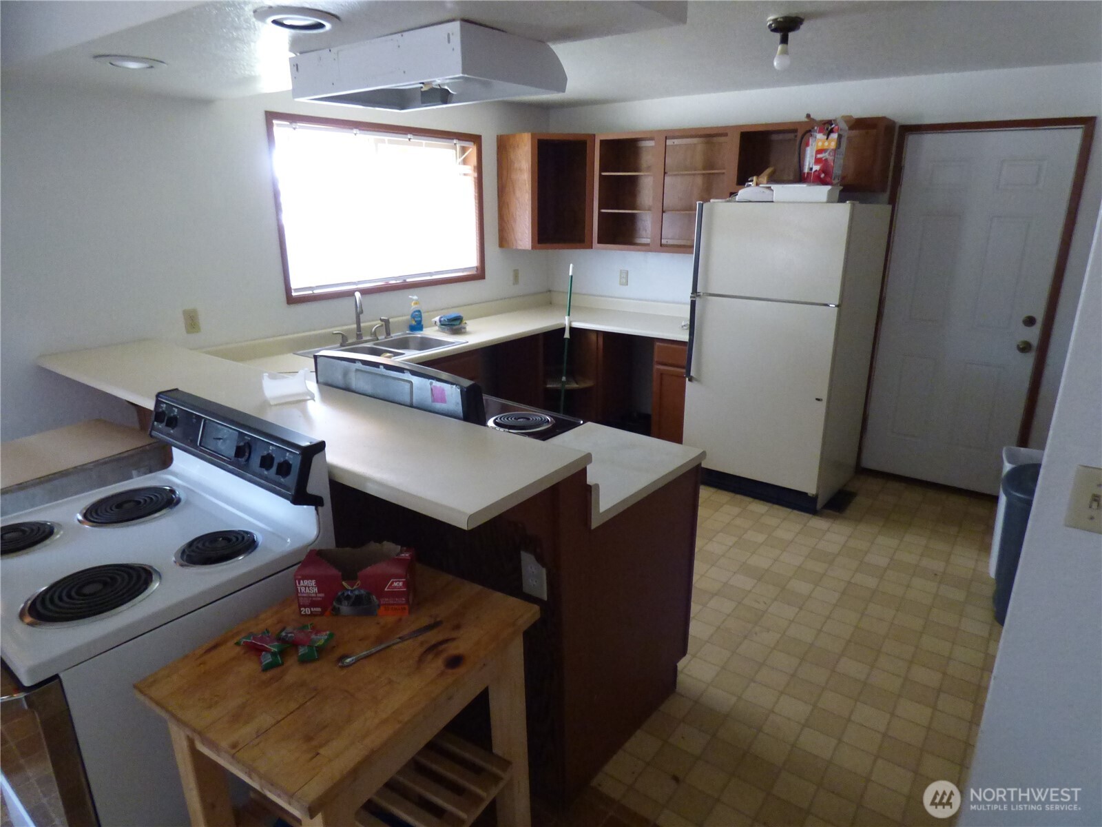 543 Jack Wells Road Bridgeport, WA 98813 - Photo 17 of 24 a kitchen with a refrigerator and a sink
