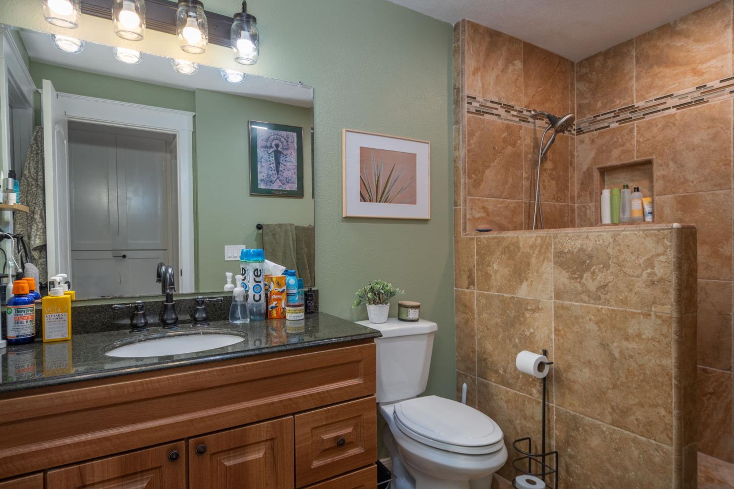 15663 Ojai Road Santa Paula, CA 93060 - Photo 11 of 47 a bathroom with a granite countertop sink mirror vanity and toilet
