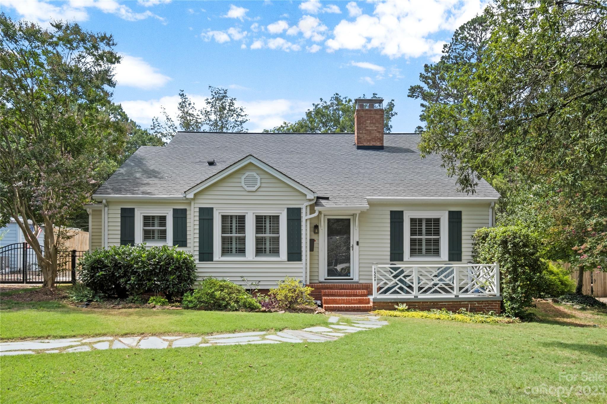 1324 Goodwin Avenue Charlotte, NC 28205 - Photo 1 of 29 a front view of a house with a yard