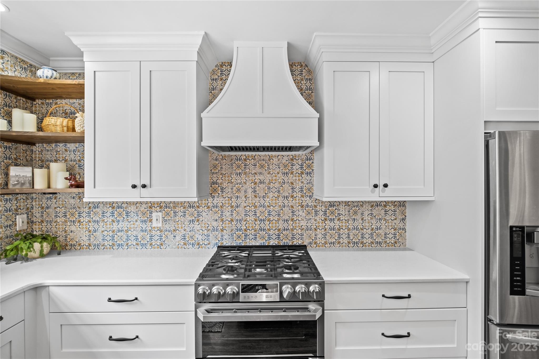 1324 Goodwin Avenue Charlotte, NC 28205 - Photo 11 of 29 a kitchen with white cabinets and appliances
