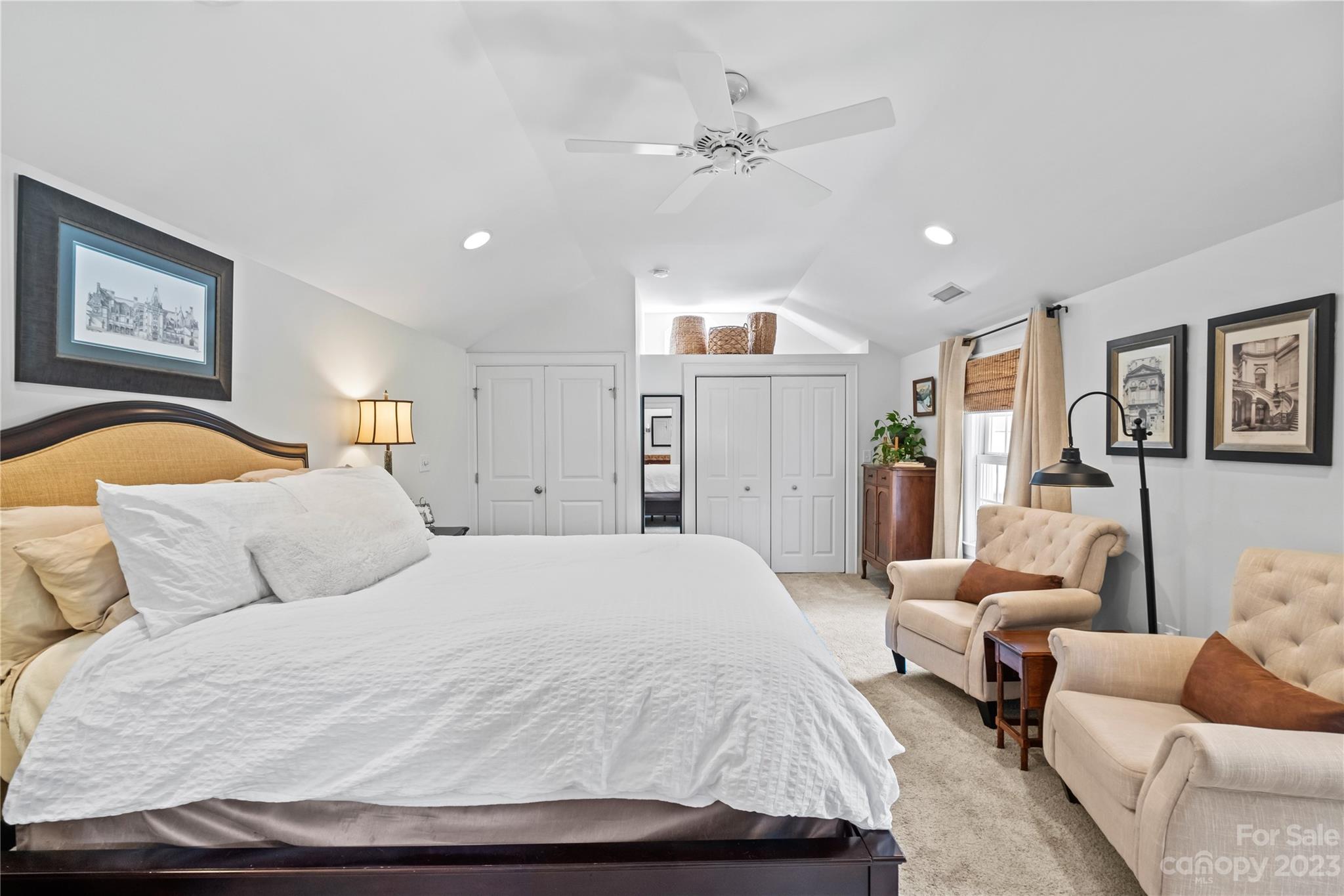 1324 Goodwin Avenue Charlotte, NC 28205 - Photo 18 of 29 a bedroom with a bed and ceiling fan