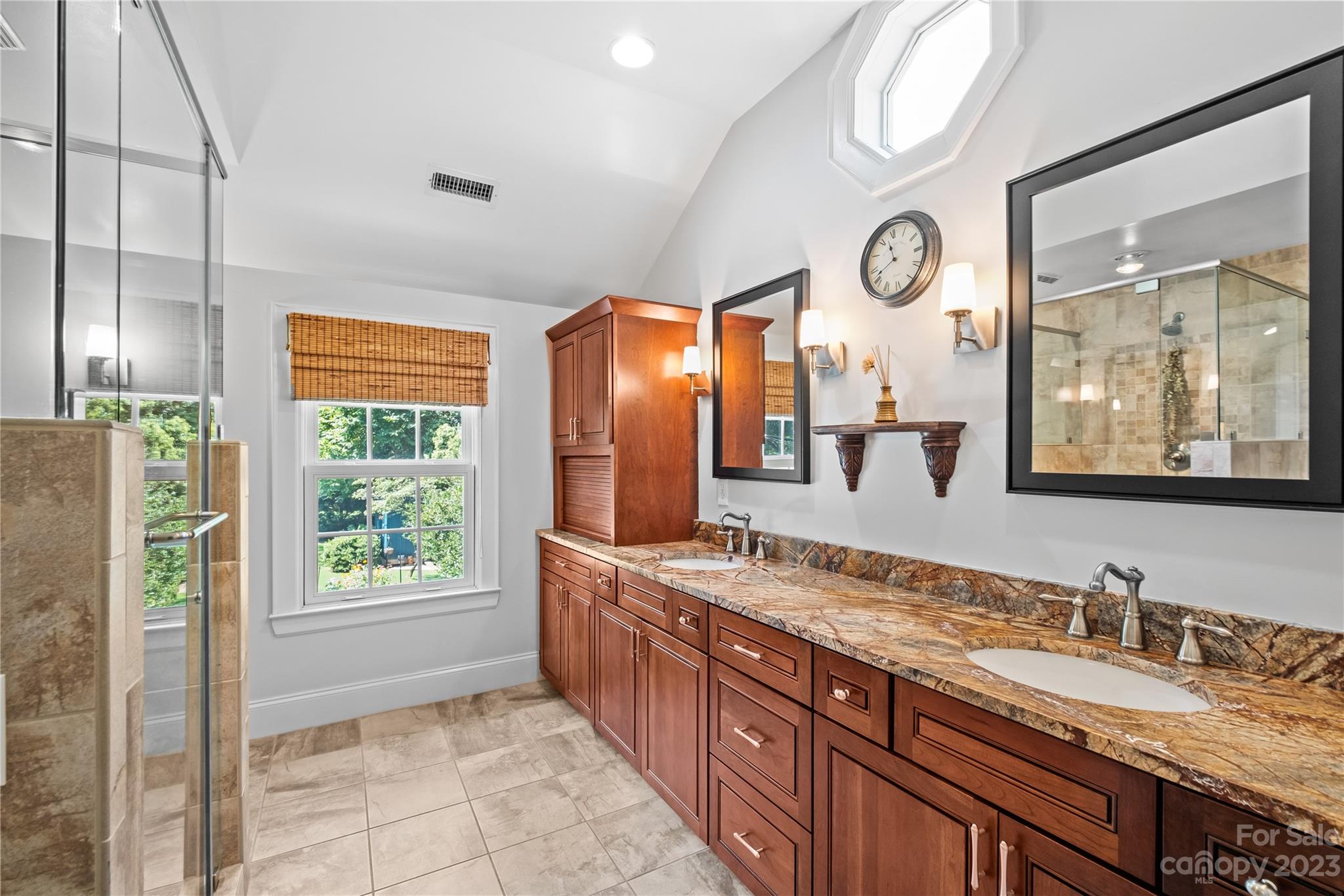 1324 Goodwin Avenue Charlotte, NC 28205 - Photo 19 of 29 a bathroom with a granite countertop sink and a large mirror