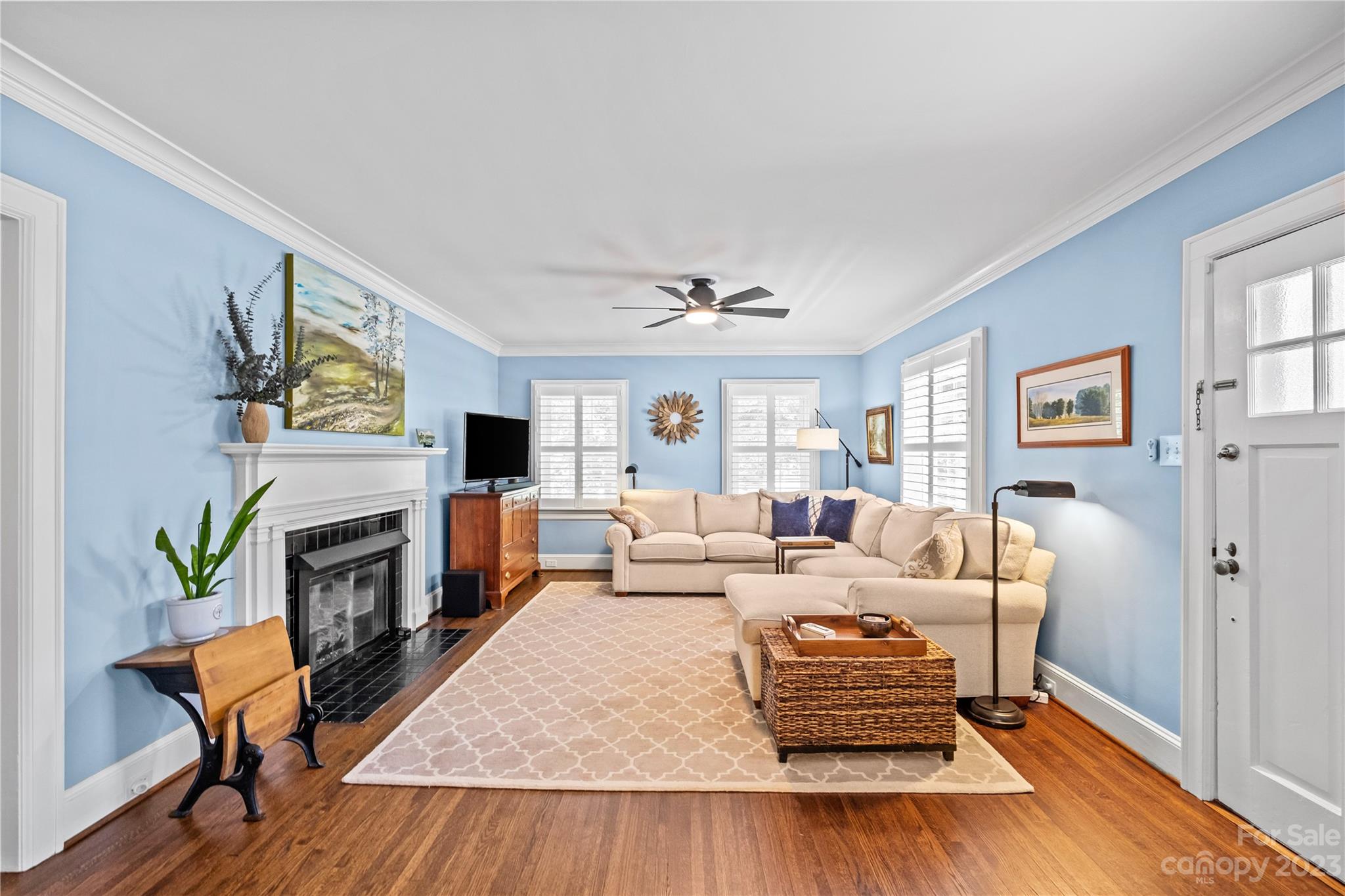 1324 Goodwin Avenue Charlotte, NC 28205 - Photo 2 of 29 a living room with furniture fireplace and wooden floor