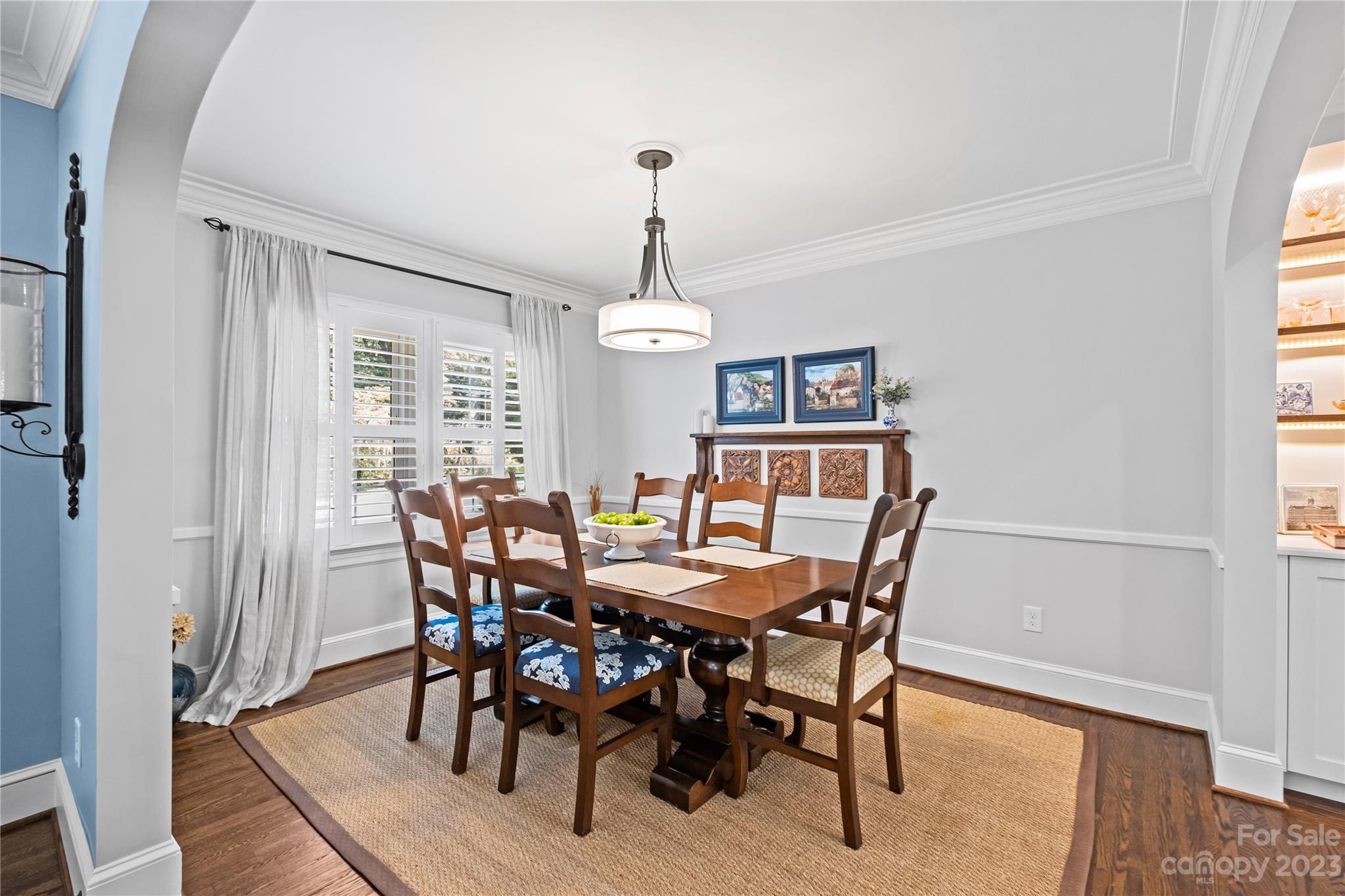 1324 Goodwin Avenue Charlotte, NC 28205 - Photo 5 of 29 a view of a dining room with furniture window and wooden floor