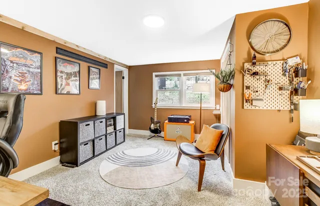 a workspace with furniture and window