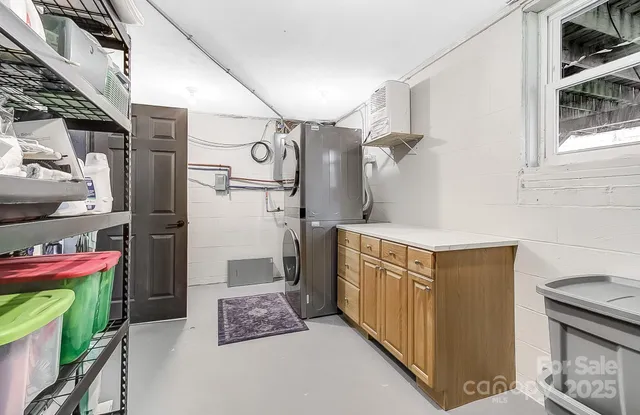 a backyard of a house with large trees and barbeque oven