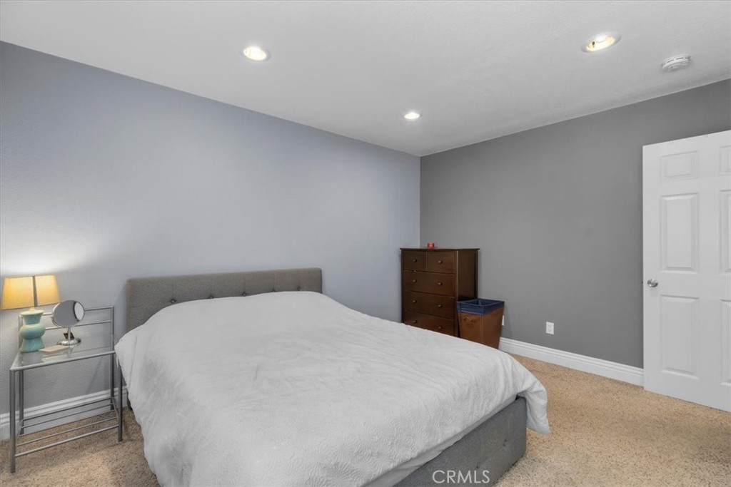 20914 Serrano Creek Road, Unit 48 Lake Forest, CA 92630 - Photo 12 of 22 a large white bed in a white room