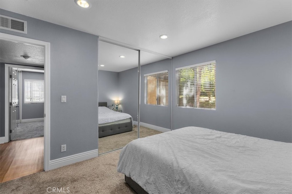 20914 Serrano Creek Road, Unit 48 Lake Forest, CA 92630 - Photo 13 of 22 a bedroom with a bed and a window