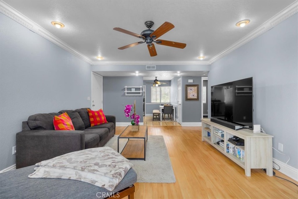 20914 Serrano Creek Road, Unit 48 Lake Forest, CA 92630 - Photo 6 of 22 a living room with furniture and a flat screen tv
