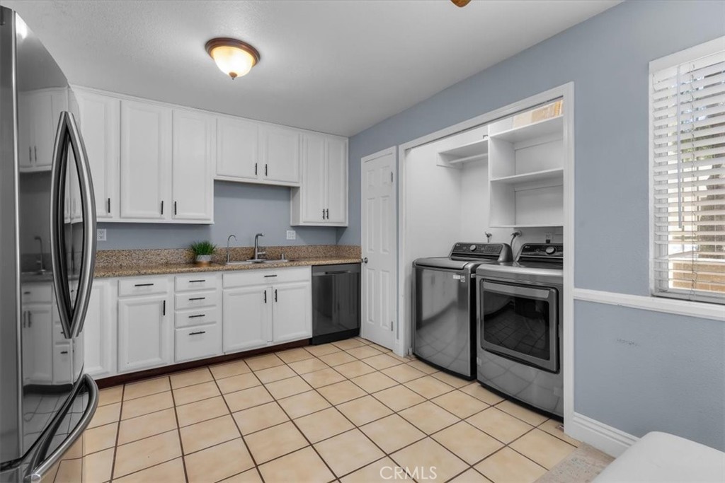 20914 Serrano Creek Road, Unit 48 Lake Forest, CA 92630 - Photo 8 of 22 a kitchen with a stove top oven sink and cabinets