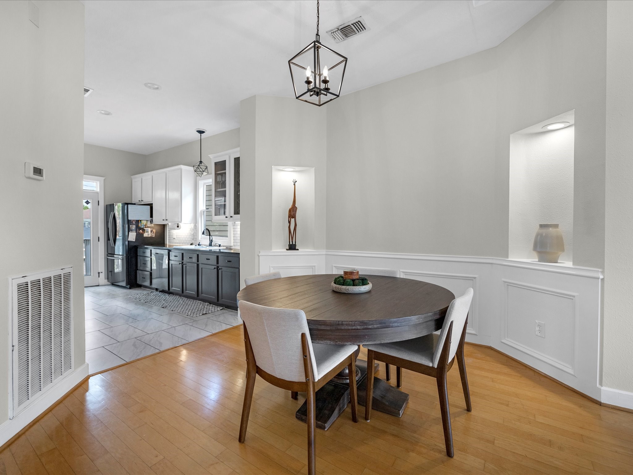403 East 25th Street Houston, TX 77008 - Photo 5 of 16 a view of a dining room with furniture and wooden floor
