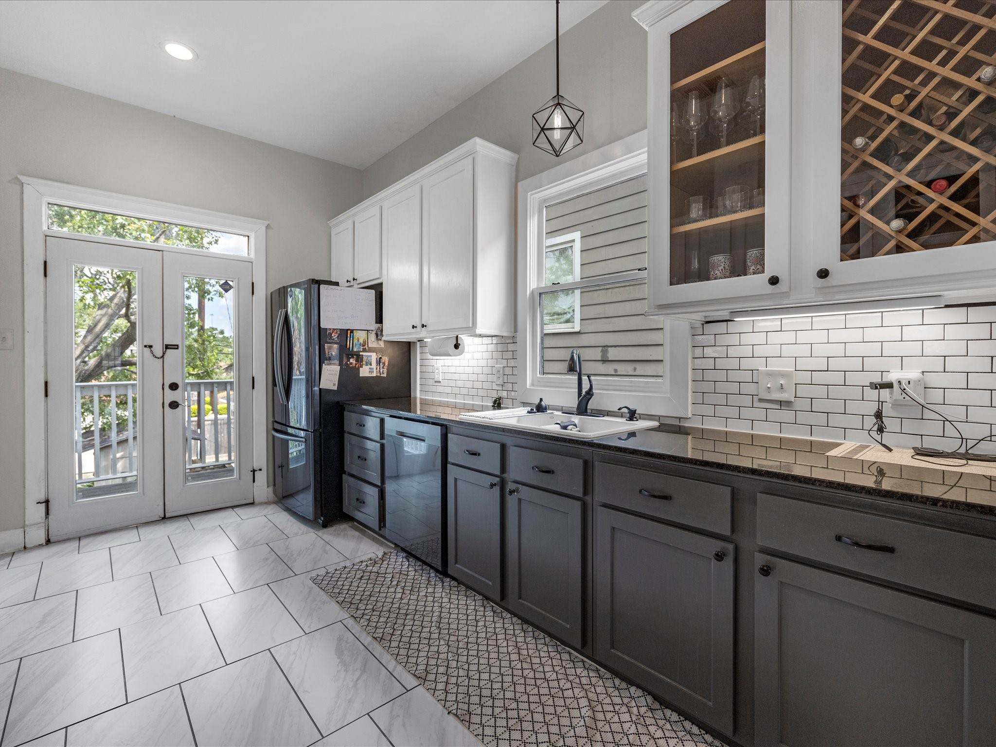 403 East 25th Street Houston, TX 77008 - Photo 6 of 16 a kitchen with stainless steel appliances a sink stove and refrigerator