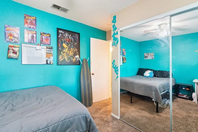 a bedroom with a bed and a table