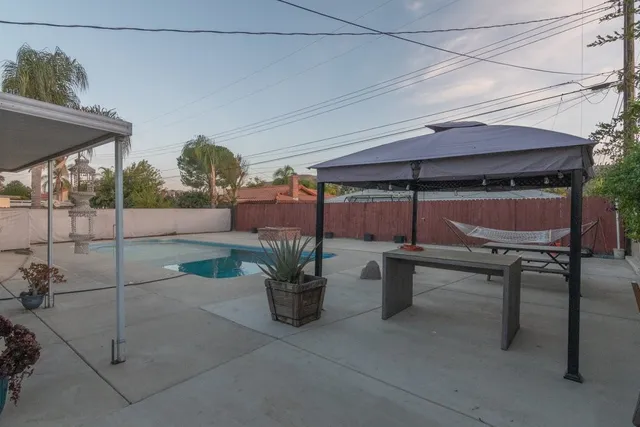 a patio with a table and chairs