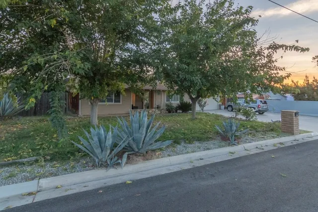 a view of a house with a street