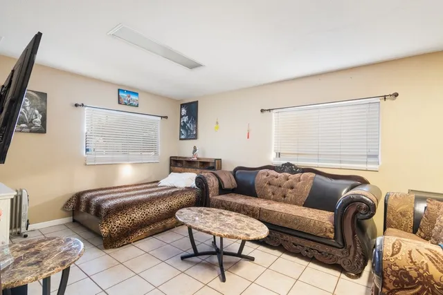 a living room with furniture and a window