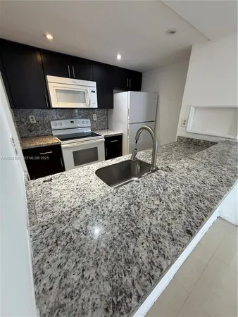 $240,000 | 7075 Northwest 186th Street, Unit C409, Hialeah, FL 33015