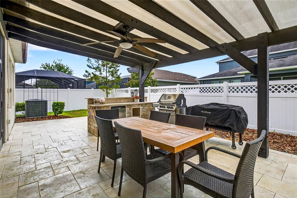 33487 Azalea Ridge Drive Wesley Chapel, FL 33545 - Photo 2 of 56 a view of a dinning table and chairs in the patio
