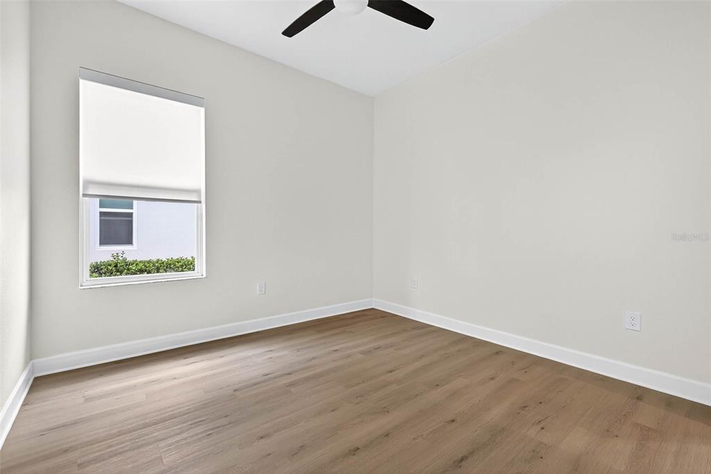 33487 Azalea Ridge Drive Wesley Chapel, FL 33545 - Photo 21 of 56 an empty room with a window