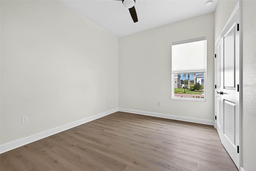 33487 Azalea Ridge Drive Wesley Chapel, FL 33545 - Photo 28 of 56 wooden floor in an empty room with a window