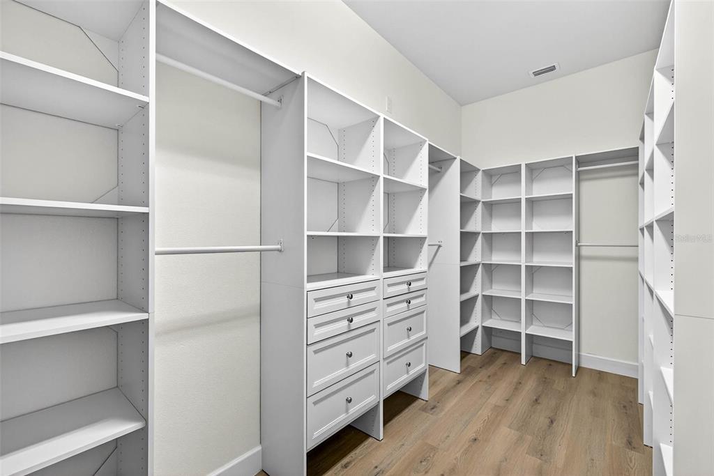 33487 Azalea Ridge Drive Wesley Chapel, FL 33545 - Photo 3 of 56 a view of walk in closet with empty racks